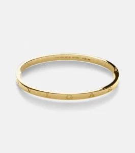 Bvlgari bracciale B.zero 1 Essential in oro giallo 18 carati, con design rigido e logo inciso. Mytheresa per la selezione Luxury Edit di Nice to be Woman